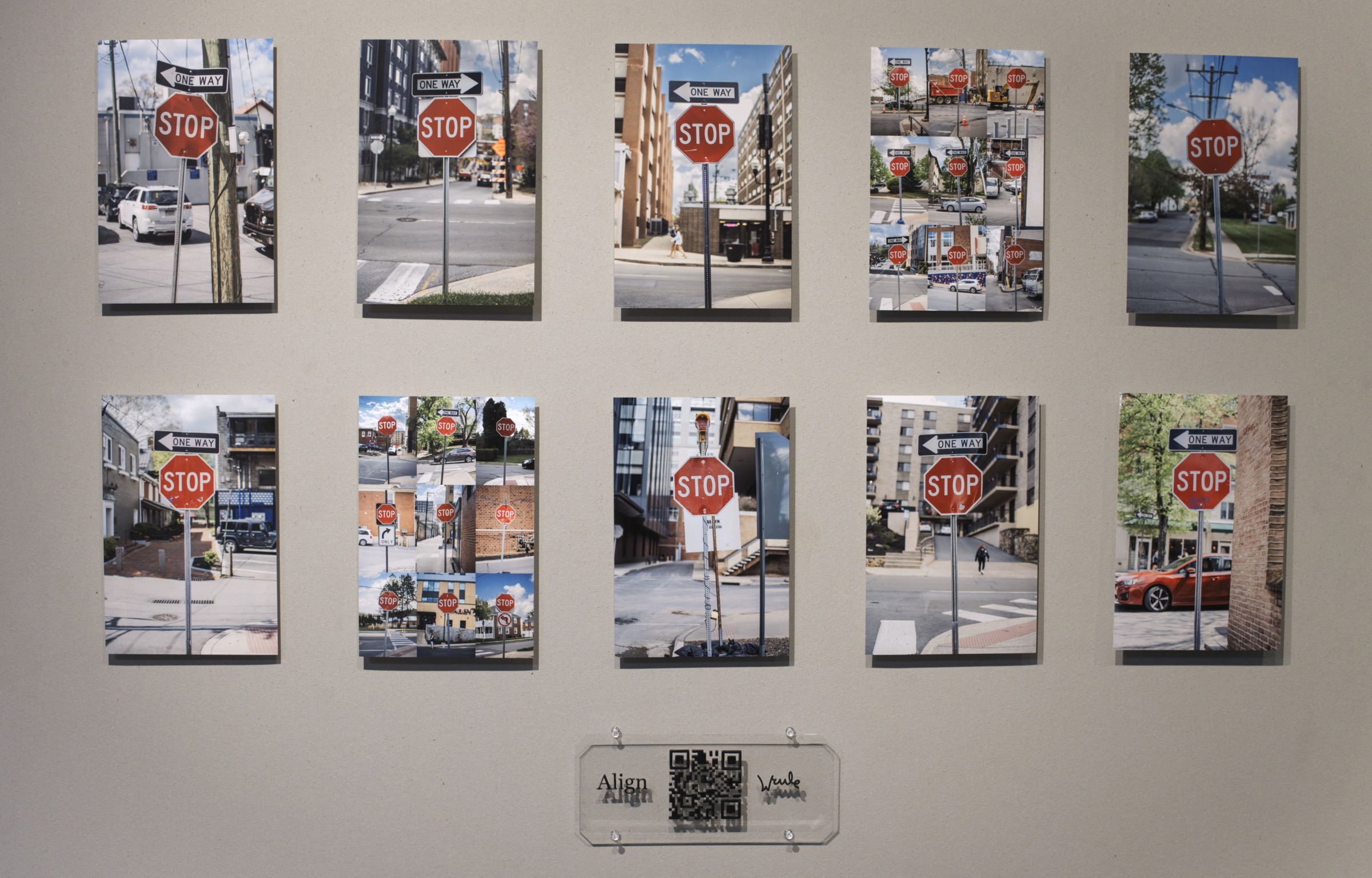 Physical Align photo gallery of stop-sign prints with QR plaque